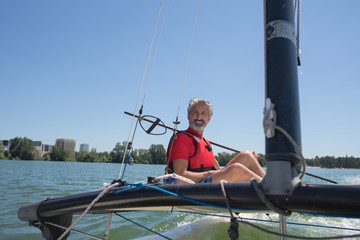 Naklejka premium enjoying extreme sailing with racing sailboat