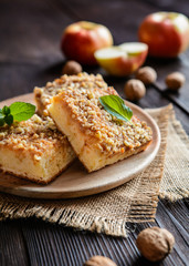 Juicy fruit cake topped with grated apple and walnut