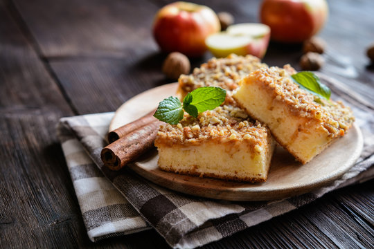 Juicy fruit cake topped with grated apple and walnut