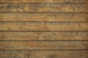 An old wooden house wall as backdrop