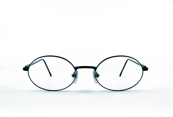 Vintage eyeglasses frontally on white backgound