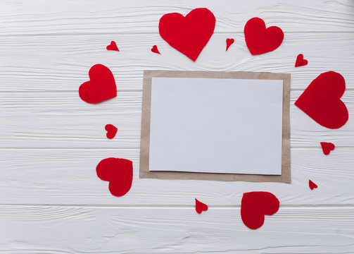 Valentine's Day. love letter, heart felt and decor on wooden background 