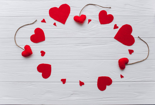 Valentine's Day. felt heart,presents  and decor on wooden background