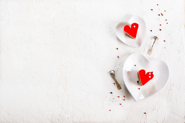 Two jelly heart-shaped cakes on white concrete background. Free space for your text.