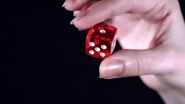 4k Poker Composition Hand Holding a Dice