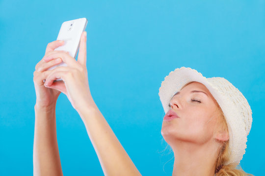 Woman taking picture of herself with phone