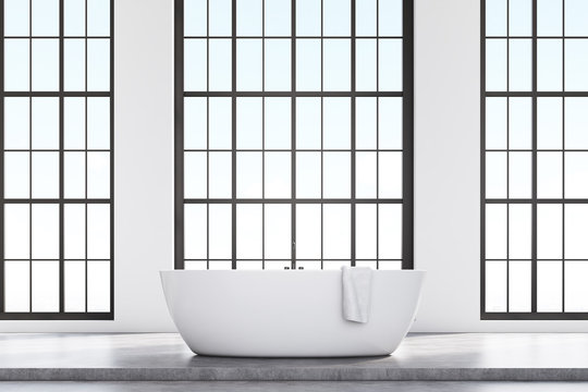 Loft bathroom with white tub