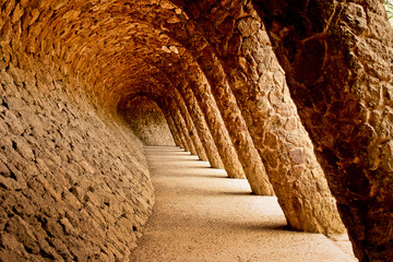 Stone walkway in the Park Guell in Barcelona, Spain. - obrazy, fototapety, plakaty