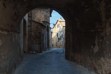 Fototapeta na wymiar Hidden streets and corners of the arches in Montalcino, Tuscany.