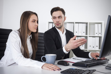 Businessman explaining stuff to his colleague