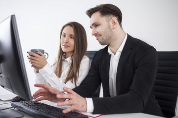 Man not impressed, woman with coffee