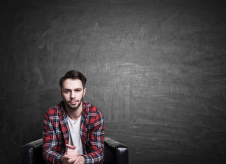 Fototapeta premium Casual guy on chalkboard background