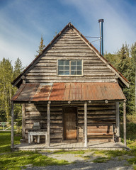 Fototapeta na wymiar September 3, 2016 - Alaskan historic log cabin Hope, Alaska