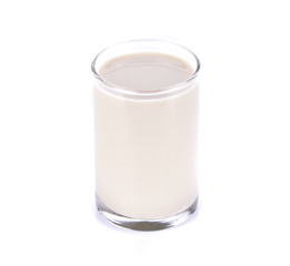 Soy milk in a glass on a white background