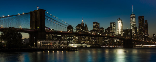 Fototapeta na wymiar OCTOBER 24, 2016 - BROOKLYN NEW YORK - Brooklyn Bridge and NYC skyline seen from Brooklyn at Sunset