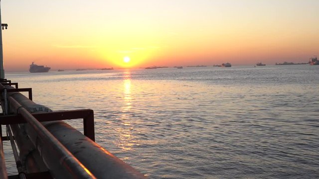 Sunrise and Cargo ship at the Yangon river in morning ,Yangon Myanmar