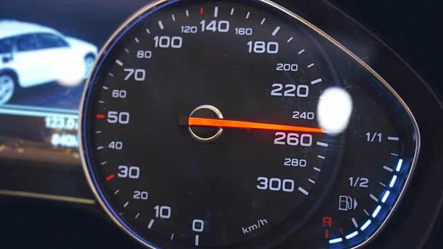 Car speedometer needle is approaching to the maximum value 300 km/h