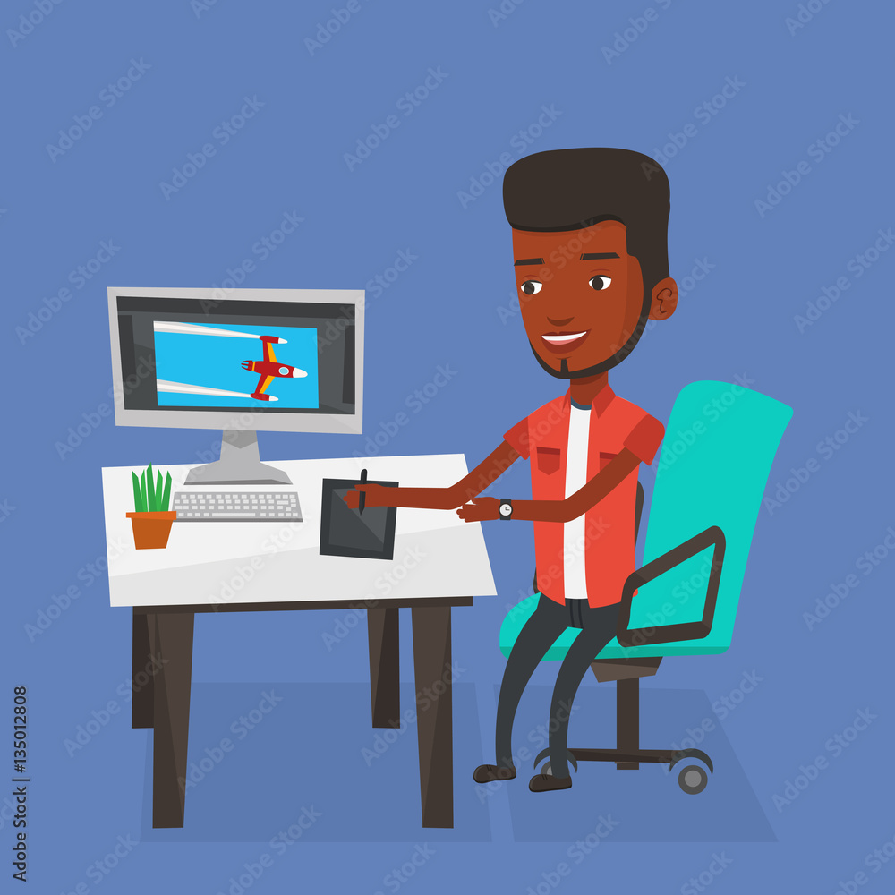 Poster designer using digital graphics tablet.