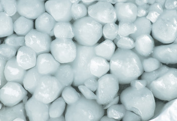 Lumps of snow and ice frazil on the surface of the freezing rive