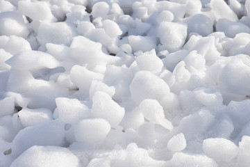 Lumps of snow and ice frazil on the surface of the freezing rive