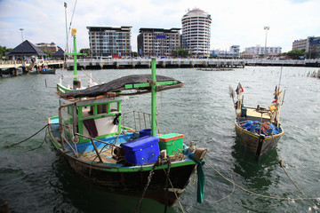 Fototapeta premium Fishing boats in a port or jetty at Thailand, as nature background or print card.
