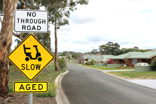 Slow And Aged Signs At The Entrance Of A Retirement Village