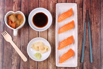 Salmon sushi and side dish served with Japanese yellow curry.