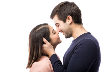 Young couple about to kiss each other