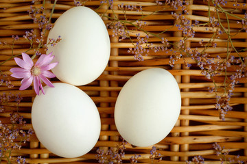 eggs on the background of a wicker basket