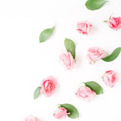Pink roses buds on white background. Flat lay, top view. Valentine's background