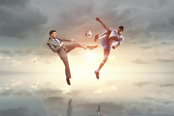 Soccer player kicking ball . Mixed media