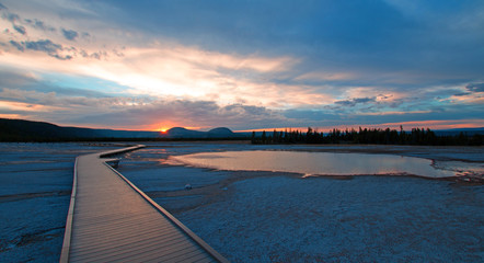Obraz na płótnie Canvas Sunset view of Walkway going by Turquoise Pool in the Midway Geyser Basin in Yellowstone National Park USA