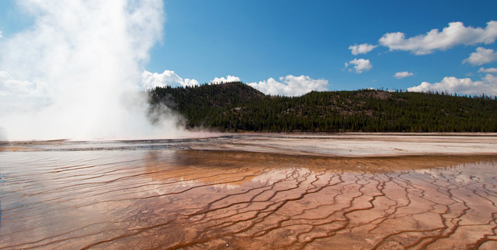 Steam rising off the Excelsior Geyser in the Midway Geyser Basin in Yellowstone National Park in Wyoming USA