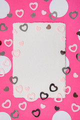 Fototapeta na wymiar Valentines day background. Colorful hearts and empty letter on a pink background.