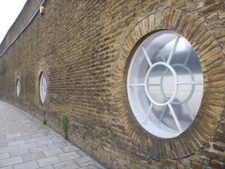 portal windows, brick wall, city streets