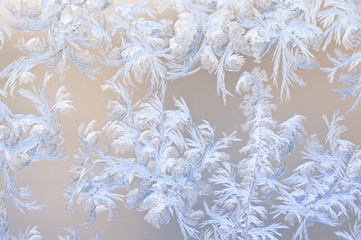 Frosty patterns on glass. Winter background.