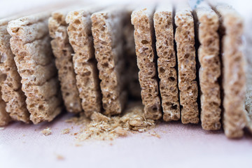 Grain crisp bread and crumbs closeup.