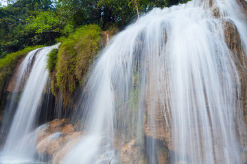 Naklejka premium Waterfall in front of stone
