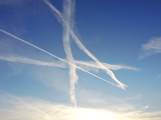 Naklejka na ściany i meble A letter created by the intertwining of aircraft contrails