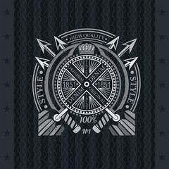 Cross arrows with round frame between two swords in center. Heraldic vintage label on blackboard