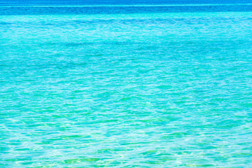 Fototapeta na wymiar Blue sea and a moving reflection of sunlight