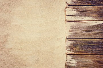 Top view of sandy beach frame. Background with copy space and visible sand texture.