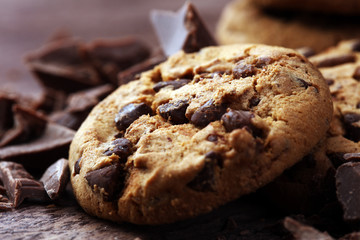 Chocolate cookies on wooden table. Chocolate chip cookies shot