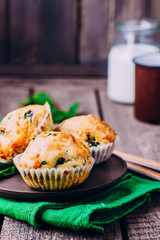 Muffins with Spinach and Cheese on Wooden Table Background. Healthy Breakfast Food Concept. Copy Space