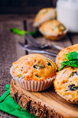 Muffins with Spinach and Cheese on Wooden Table Background. Healthy Breakfast Food Concept. Copy Space