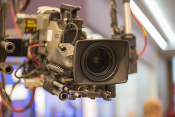 TV professional camera on crane shooting  show in studio decoration.
