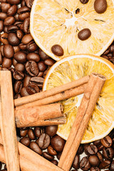 Coffee beans in bulk with cinnamon sticks