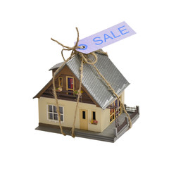 Model of an apartment house with label sale.