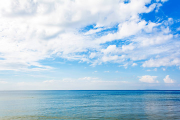 Blue sea and a moving reflection of sunlight
