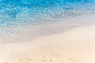 Fototapeta na wymiar Close up sand with blurred sea sky / Paradise Tropical beach bac